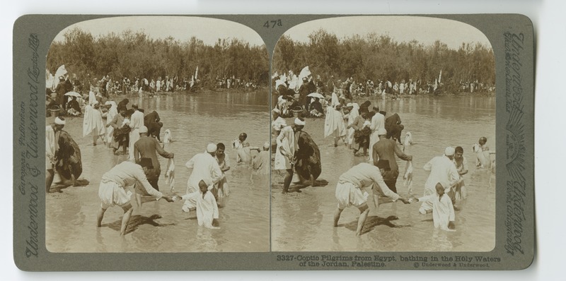 Pilgrims of the Coptic Church who have traveled from Egypt bathe in the waters of the Jordan River.