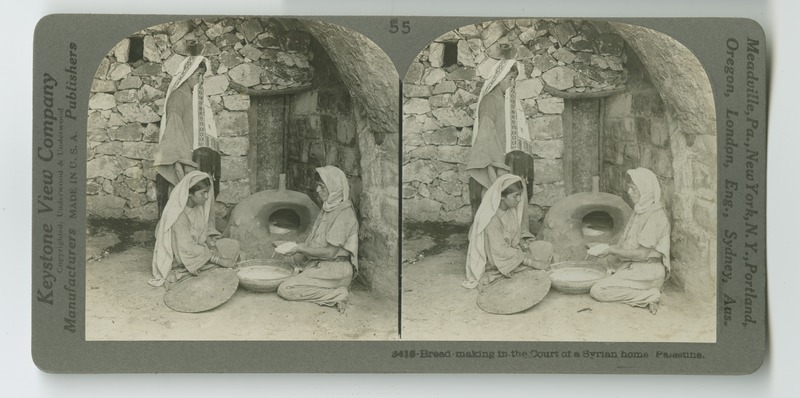 Three women prepare bread to bake in a stone or clay oven placed in the courtyard of a home.
