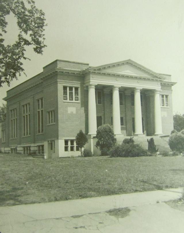 An unidentified church building in the neoclassical style with a view of the large front porch with columns.