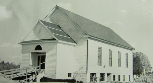 The Wesley Chapel Methodist Church building with a view of the front door.