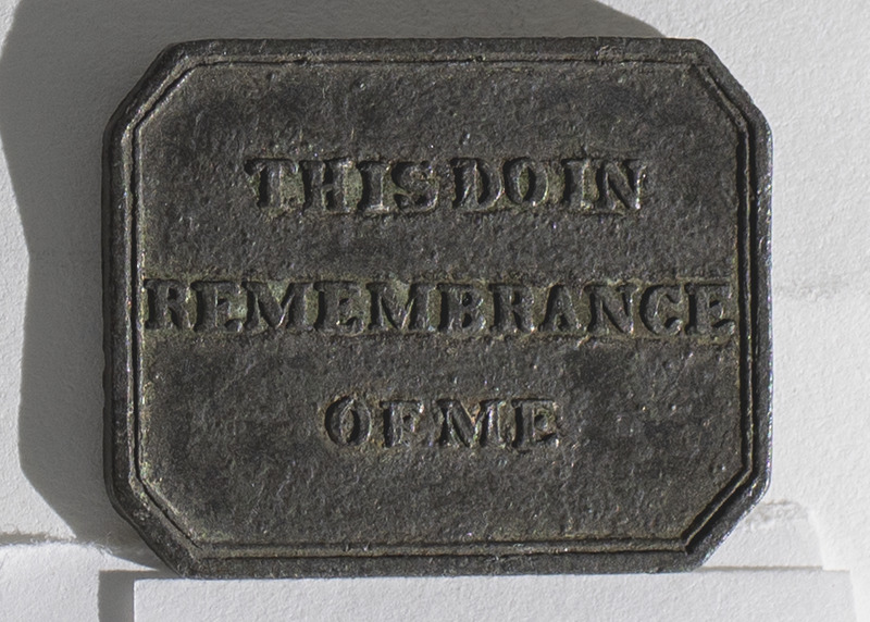 A communion token from the Free West Church in Aberdeen, Aberdeenshire, Scotlans. The token is rectangular with inscriptions on the obverse, &quot;Free West Church AberdeenTable,&quot; and reverse, &quot;This Do in Remembrance of Me&quot;. The date &quot;1831&quot; is written on the center of the obverse side of the token.